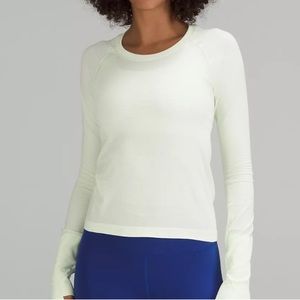 White Lululemon long sleeve. Size 10, gently used